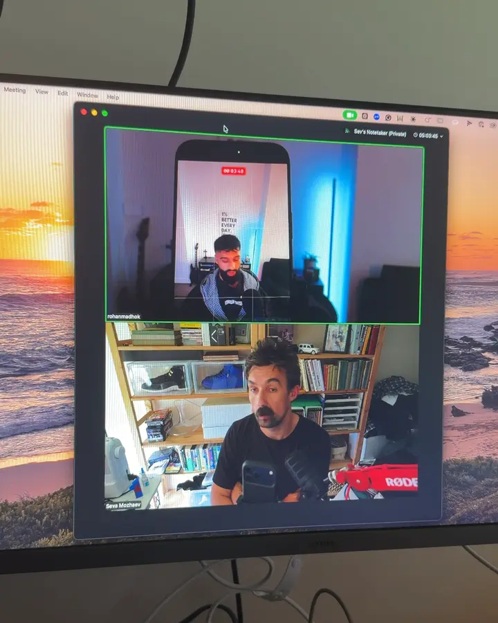 Sev coaching a client over a video call while they film themselves on their phone